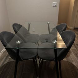 Modern 5 piece dining set - glass top table y 4 grey velvet chairs