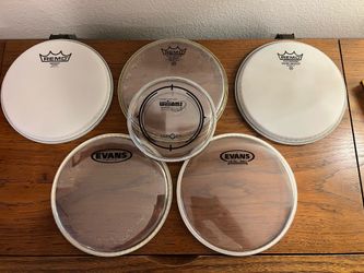 🥁 $68 value lot of 4x Brand New premium drum heads by Remo and Evans, with two free bonus heads.