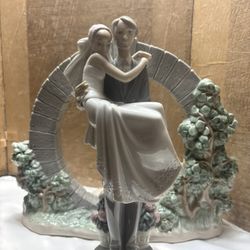 Lladró "Bride & Groom" porcelain figurine set, which includes the couple sculpture and the rare "Bermuda Moongate"