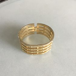 Gold tone clamper bracelet