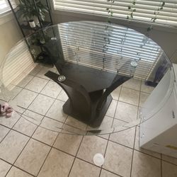 Bar stool height table with glass top 