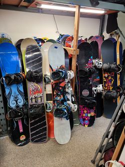 Snowboard gear. Boards with bindings snowboard boots snowboard jacket snowboard pants ski pants ski jacket goggles gloves helmets