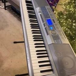 Yamaha Portable Grand 76-Key Electronic Music Keyboard with Portable Stand & Charger