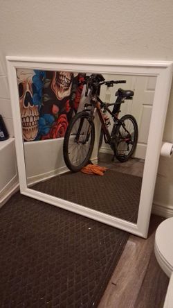 38inch by 38 inch wood trimmed mirror