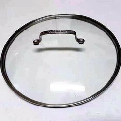 Stainless Steel Glass Lid of 11 3/4" Inner Rim Size & the outer edge is 12 1/4"

