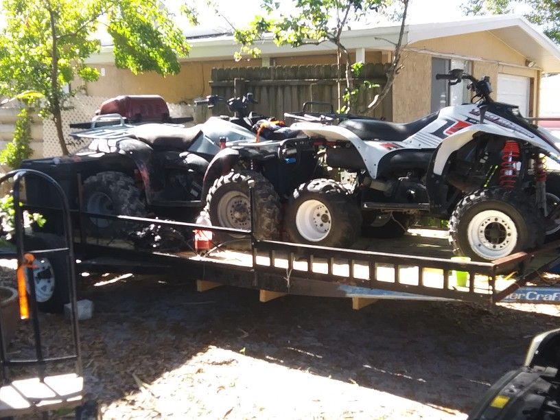 2 Atvs and trailer.polaris 2005 Traiblazer 250,polaris 1997 Trailboss