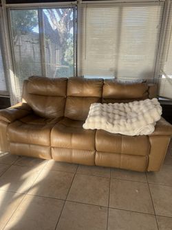 Title: Brown Leather Reclining Sofas - $20 Each