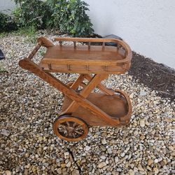 ANTIQUE WOODEN ROLLING TABLE .VERY UNIQUE