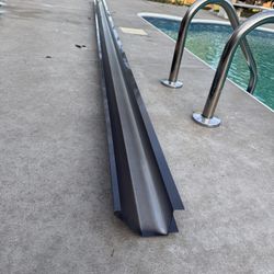Large 15’ Sections of Heavy Gauge Gutters! Color is bronze.  2 available and brand new!