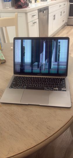 2020 M1 MacBook Air. Works perfectly with external monitor. Internal display damaged (see photos). Battery, keyboard, trackpad, ports, and motherboard
