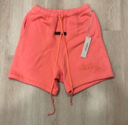 Fear of God Essentials coral shorts medium