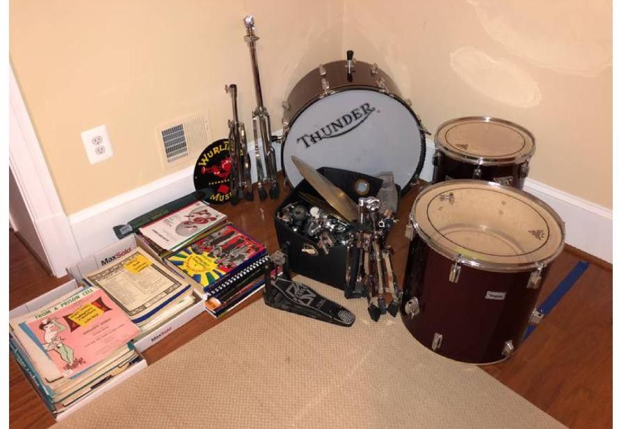 Thunder drum set with collection of music sheet