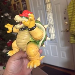 The Super Mario Bros. Movie 7-inch Bowser Figure with Fire Breathing Effect. 