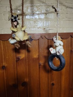 Hanging dog statues