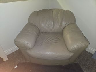 Taupe leather overstuffed armchair
