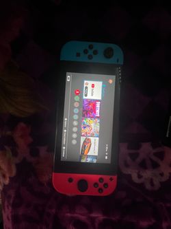 Nintendo Switch with Neon Red and Blue Joy-Cons (“looking for trades too”)