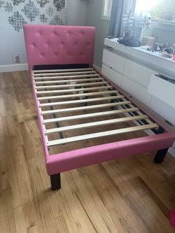 Twin bed frame. got a little scratch of my cat in the head board