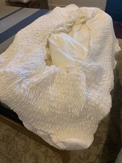White elastic bed mattress cover.