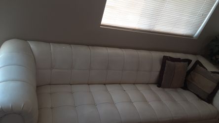 Large, white-leathered couch 