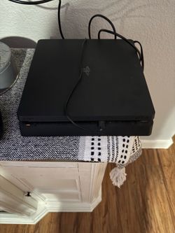 PlayStation four with three games