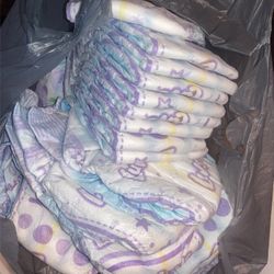 Bag Full Of Unused Luvs Size 2 Diapers