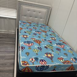 Twin bed with mattress and box spring