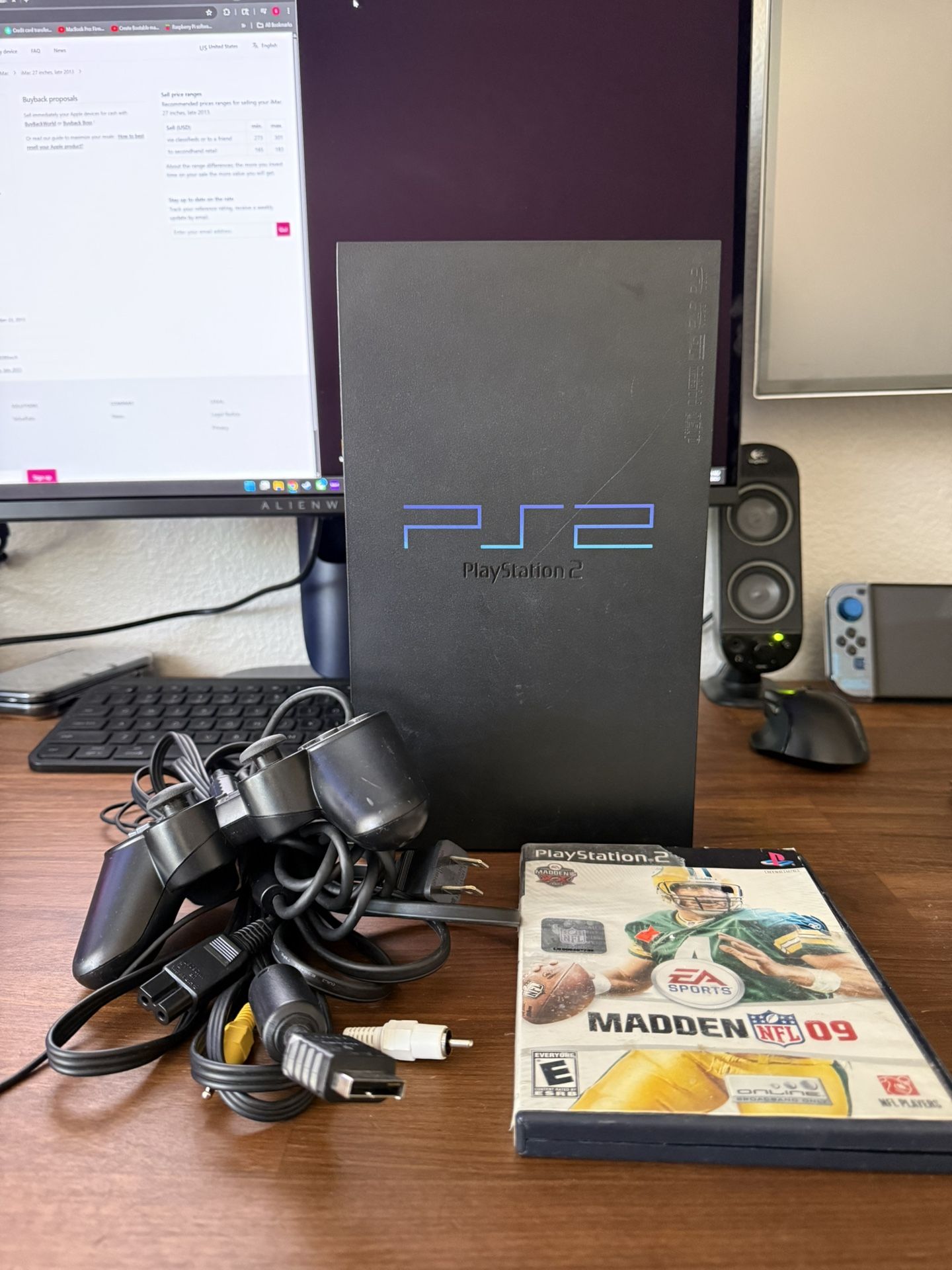 PS2 (Fat) with a game and controller 