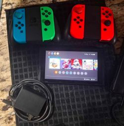 Nintendo switch with 4 controllers