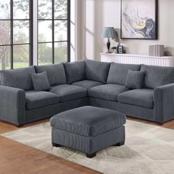 F8303. 99x99 GREY SECTIONAL SOFA AND OTTOMAN 