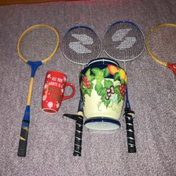 Mug And Base And Tennis Rackets