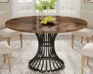 Round wooden table with pedestal