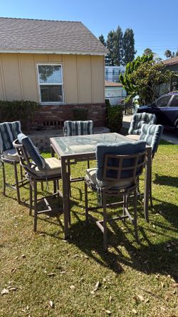Glass table and metal high top chairs