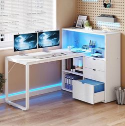 L a desk with bookshelf , drawers and outlets