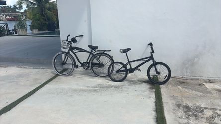 2 black bikes bicycles