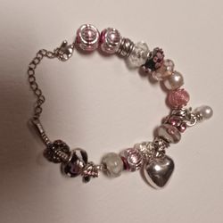$4 - Silvertone Charm Bracelet With Pink Beads