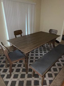 Caleb Dining Table, Dining Bench and 3 chair. Nothing broken or scratched. Paid $1600