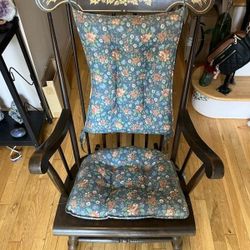 Old wooden rocking chair with cushion $85