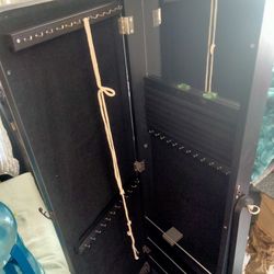 Mirror with jewelry cabinet