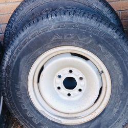 SET OF 4 NEAR NEW TIRES ALL SEASON AND STOCK WHEELS