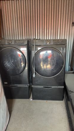 Samsung Front-Load Washer and Dryer Set combo with Pedestals.
