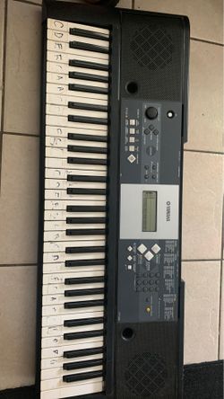 Yamaha piano with stand