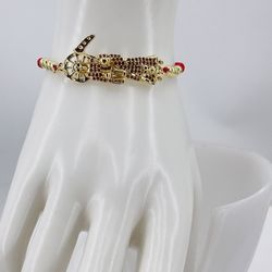 La Santa Muerte ajustable chapado en oró 18k/The Grim Reaper adjustable bracelet gold plated 18k