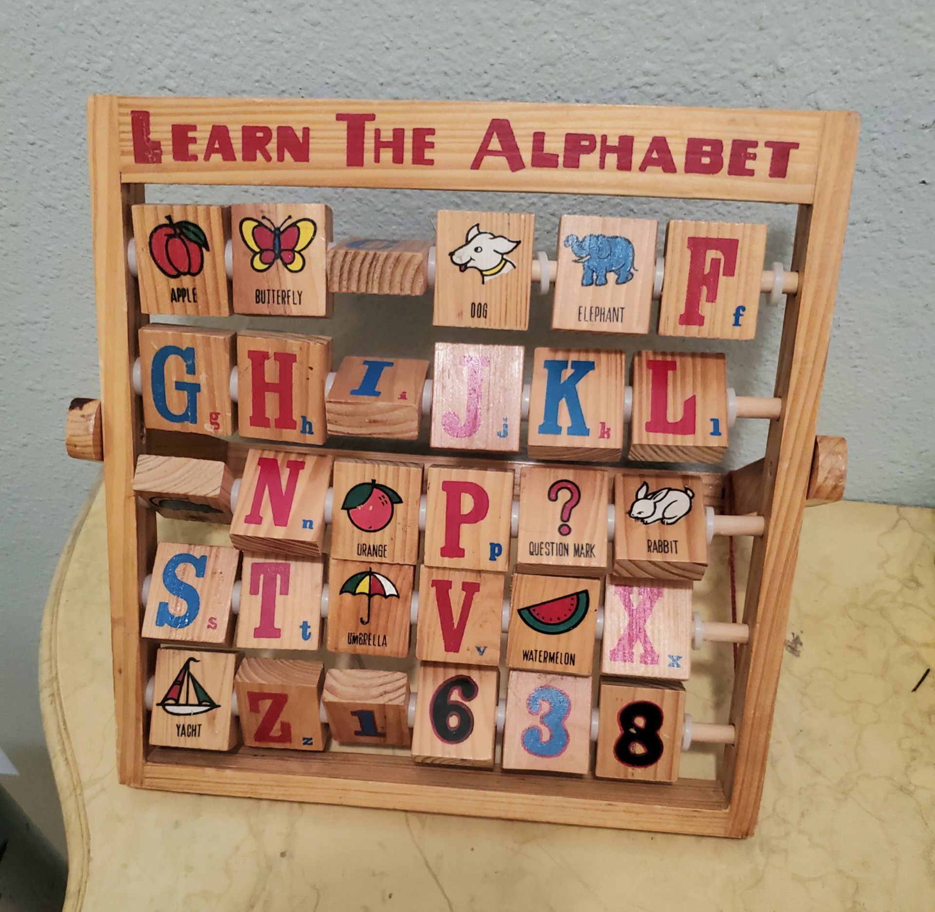 Vintage wood block learning the alphabet abacus