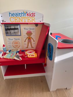 Melissa and Doug Wooden Doctor and Dentist Play Center