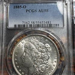 1885 O $1 Morgan AU 58