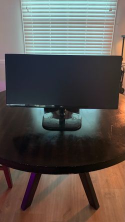 LG 25UM57-P, a 25-inch ultrawide (21:9) IPS monitor from around 2015–2016 with HDMI input.