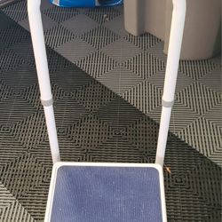 Portable step stool with a handle designed for safety and mobility assistance.  Lightly used