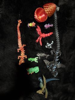 pack of 3D printed objects, containing five  dragons, one axolotl, one whale one dinosaur one frog one lobster one llama from Fortnite one eg