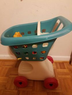 Kids shopping cart with toy fruit