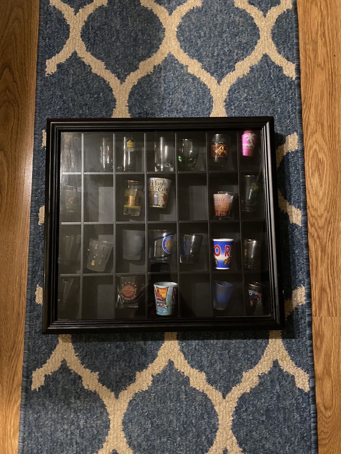 Case Of Shot Glasses From Various Cities Throughout The World